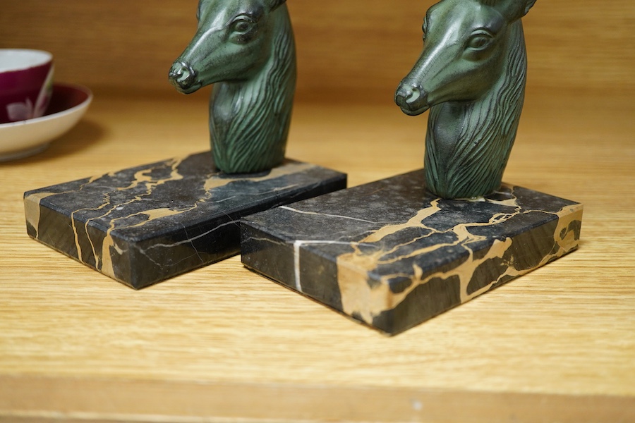 A pair of French bronzed stags head bookends, 19cm high